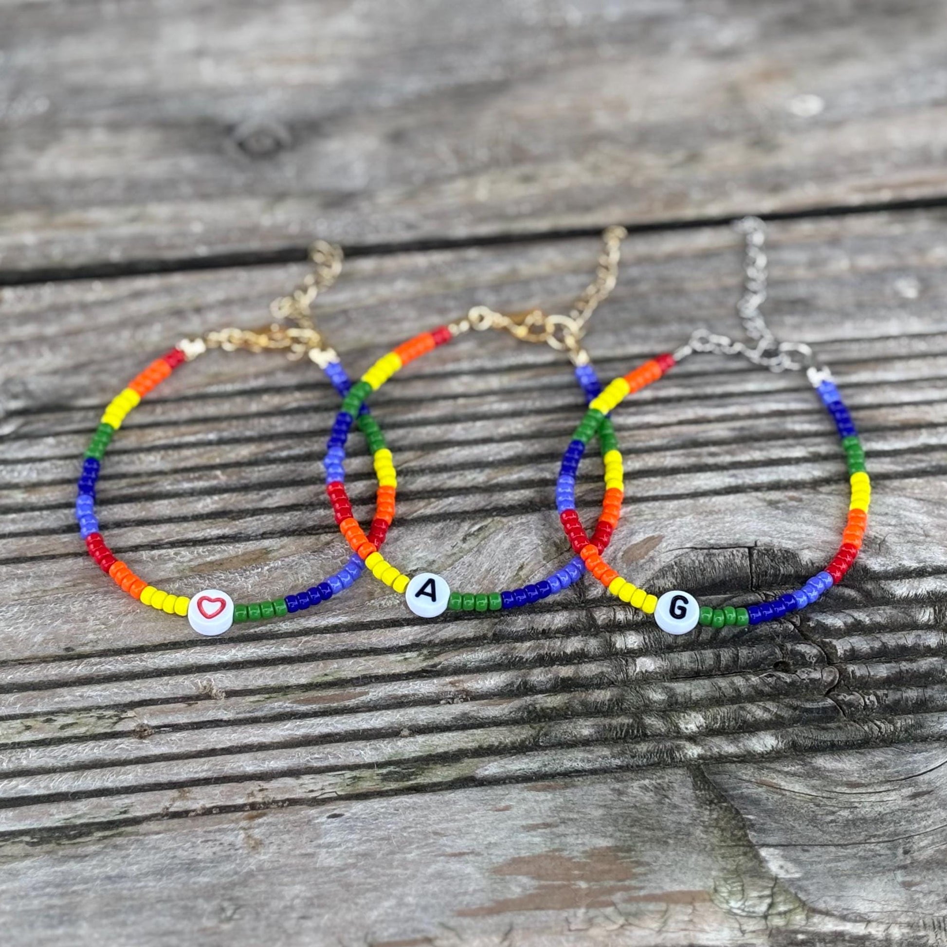 Colorful beaded bracelets on a wooden surface