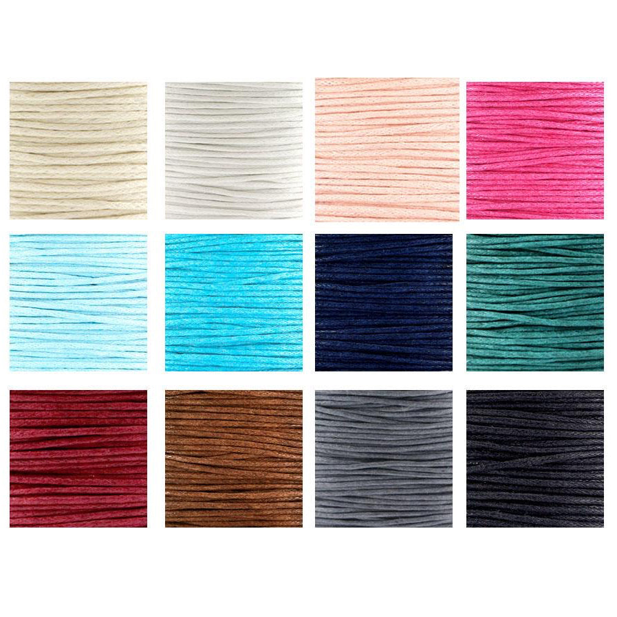 Collection of colorful string or cord in various shades on a white background