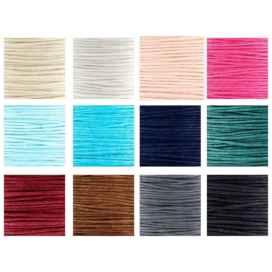 Collection of colorful string or cord in various shades on a white background